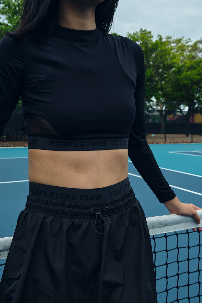 Black open-back long sleeve tennis top