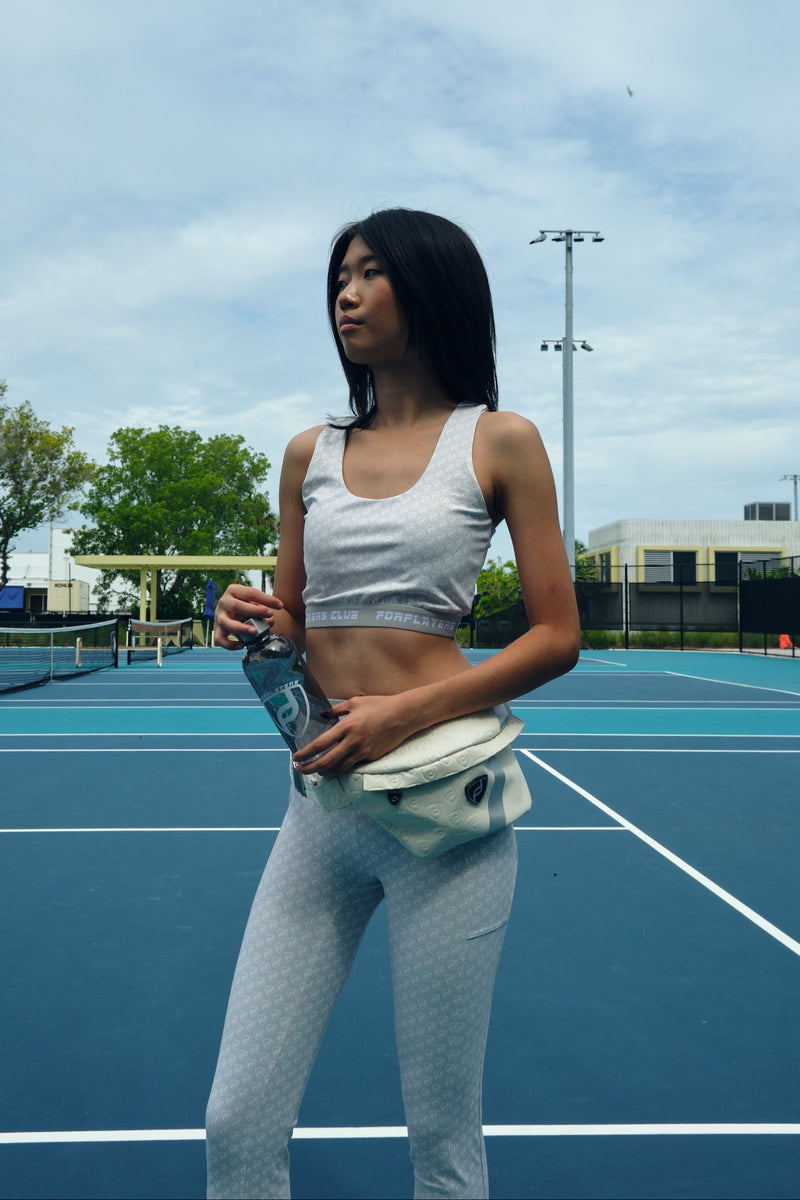 White monogram sports bra with tennis skirt